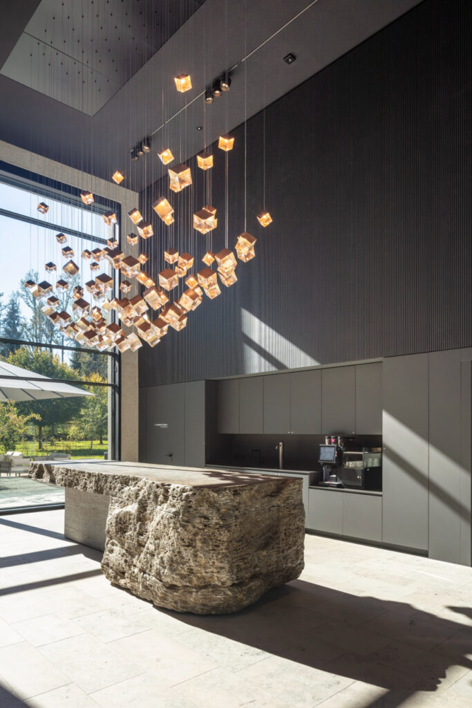 BOMMA Pyrite collection chandelier installation, contemporary luxury interior design