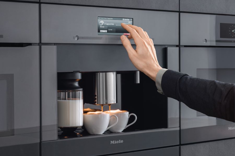 Miele built-in coffee machine with three-bean storage integrated into kitchen cabinetry