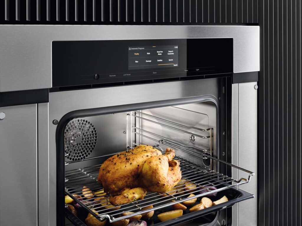Miele flush-mounted handle-less built-in oven in contemporary kitchen
